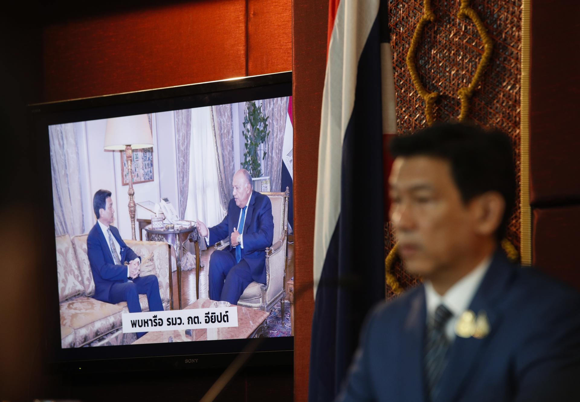 Thai Foreign Affairs Minister Parnpree Bahiddha-Nukara speaks next to a screen displaying a meeting between him and Egypt's Foreign Minister Sameh Shoukry during a press conference over the situation of Thai migrant workers being held hostage in the ongoing conflict between Israel and Hamas, at the Ministry of Foreign Affairs in Bangkok, Thailand, 03 November 2023. EFE-EPA FILE/RUNGROJ YONGRIT
