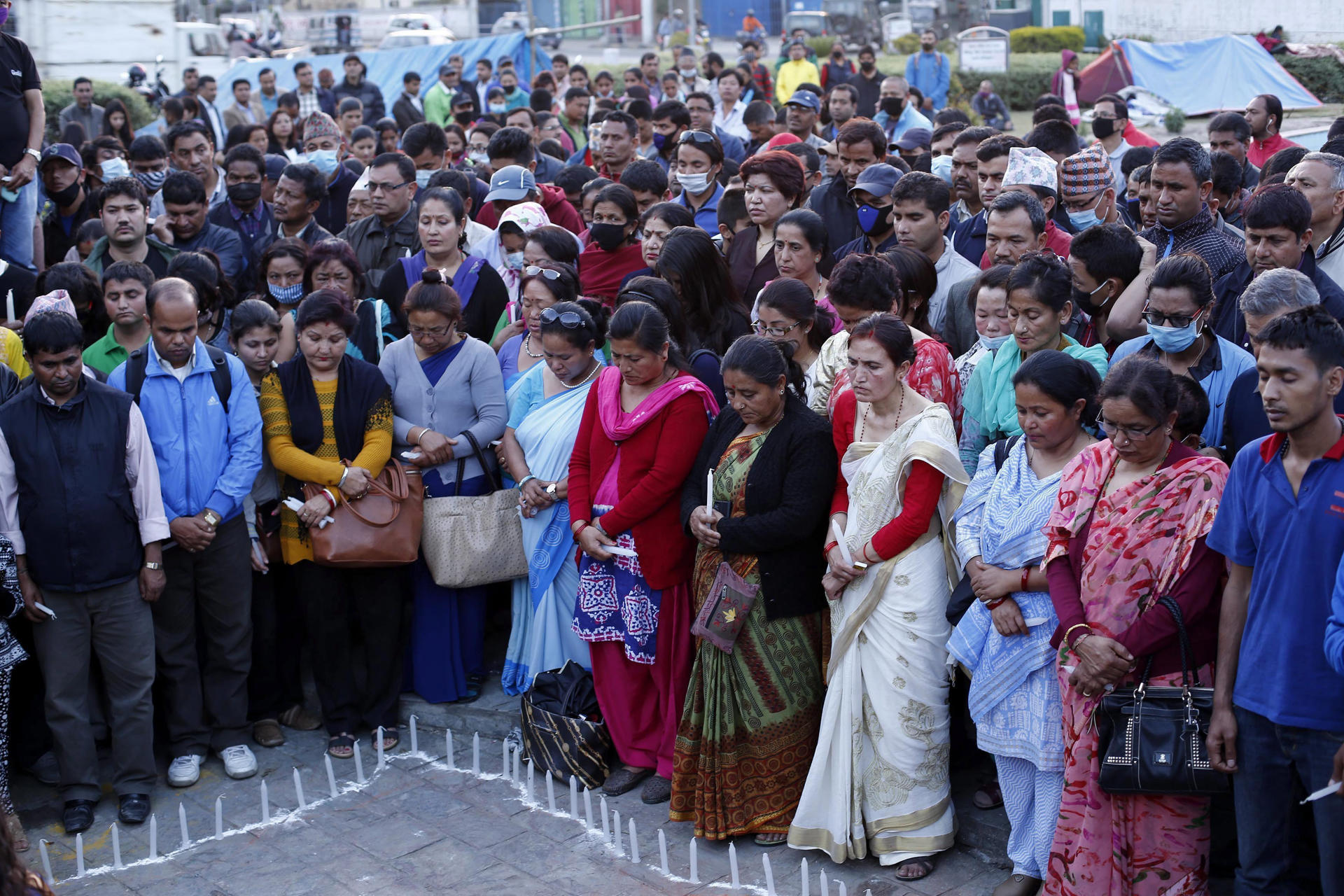 People from all walks of life attend a candlelight vigil to remember the earthquake victims organized by the Joint Trade Union Coordination Center at Babormahal, Kathmandu, Nepal, 01 May 2015. EPA/ABIR ABDULLAH/FILE