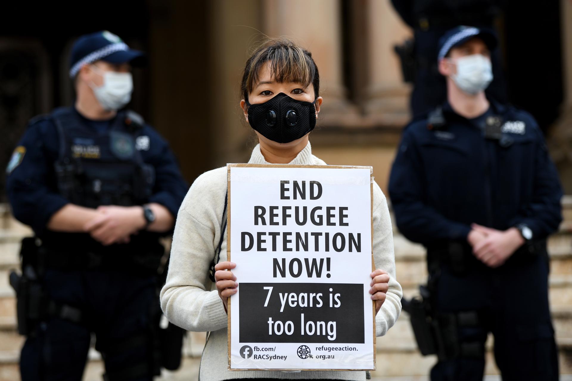 A protester holds a placard during a 'Free The Refugees' rally outside Sydney Town Hall in Sydney, Australia, 13 June 2020. EFE-EPA FILE/BIANCA DE MARCHI AUSTRALIA AND NEW ZEALAND OUT