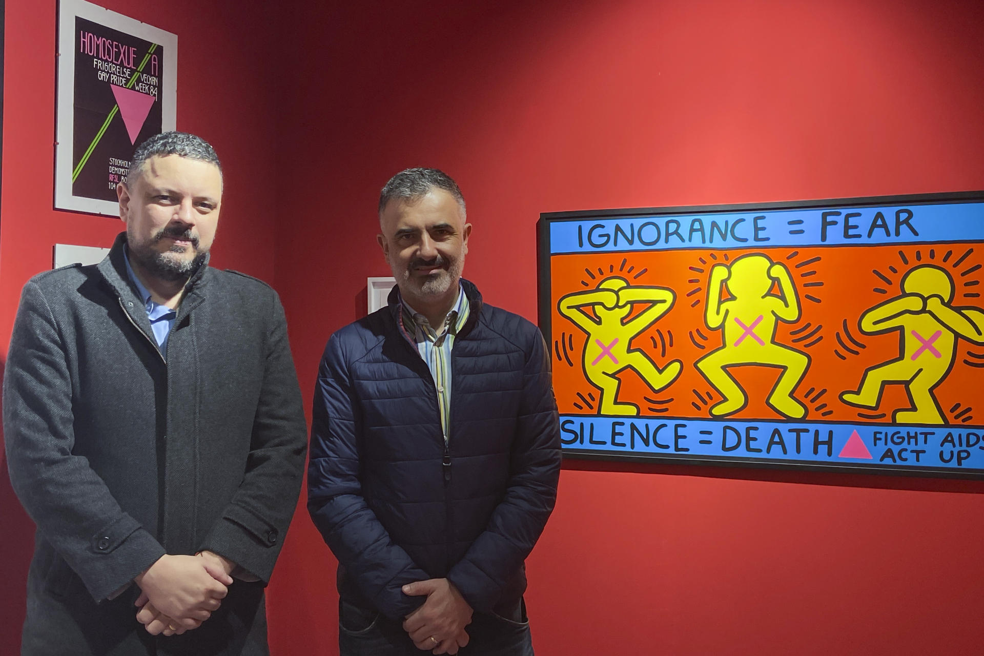 Halim Badawi (left), curator of the exhibition 'Memories of HIV/AIDS in Latin America', and Pedro Felipe Hinestrosa (right), director of the Archivo Arkhé, at the opening of the exhibition in Madrid on Friday. December 1, 2023. EFE/ Carlos Caselles
